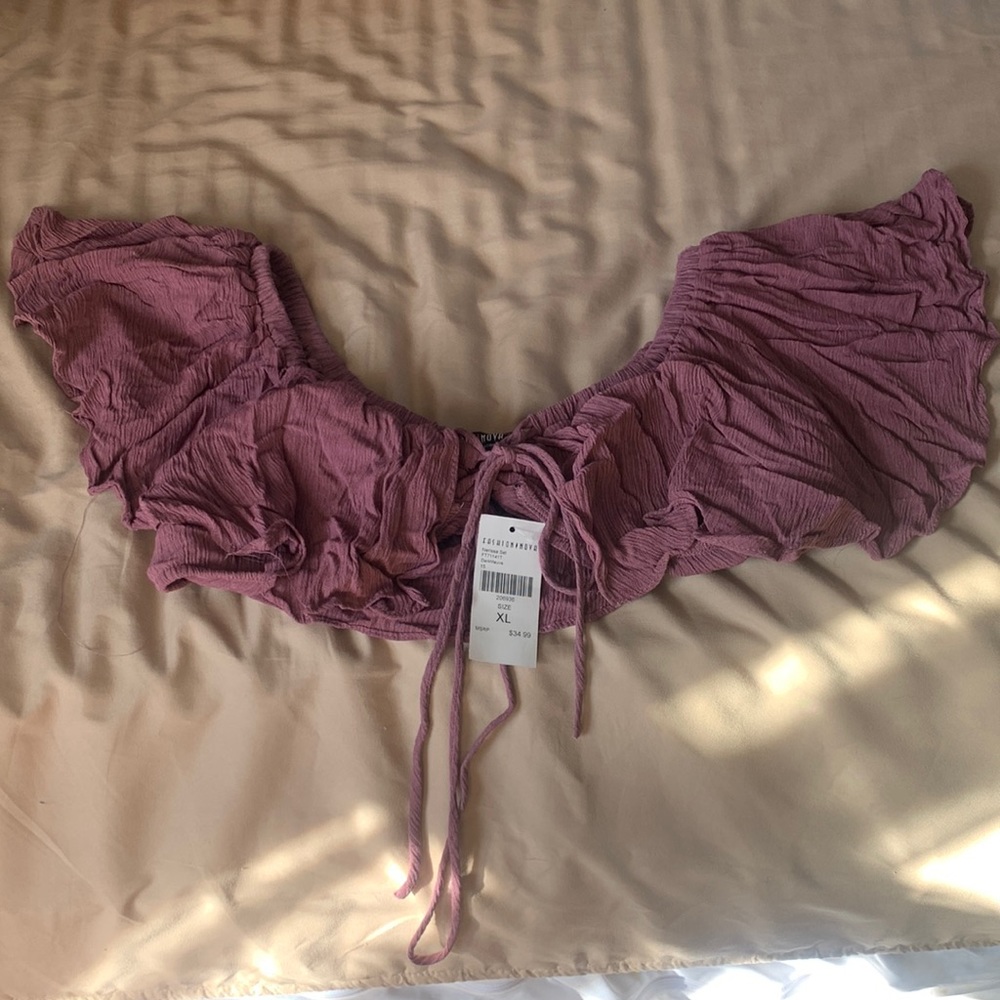 dark mauve color top. Wear it with jeans, shorts and it falls off the shoulder